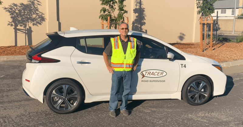 Maintenance Manager Scott Perriera poses in front of an electric vehicle in Tracy, California. We're excited to announce that we have integrated electric vehicles and hybrid vehicles our fleets as we look for ways to go green!