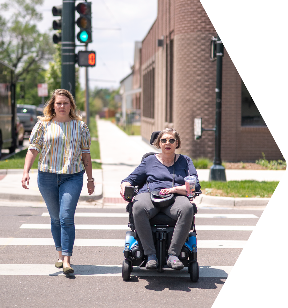 Travel trainer and trainee crossing the street
