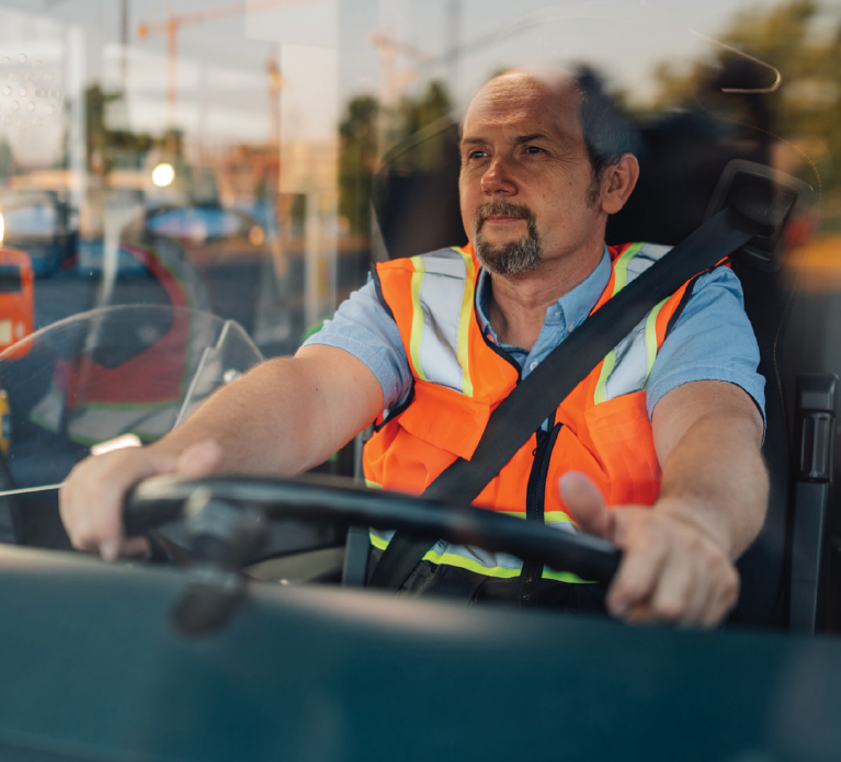 Bus driver wearing a safety vest