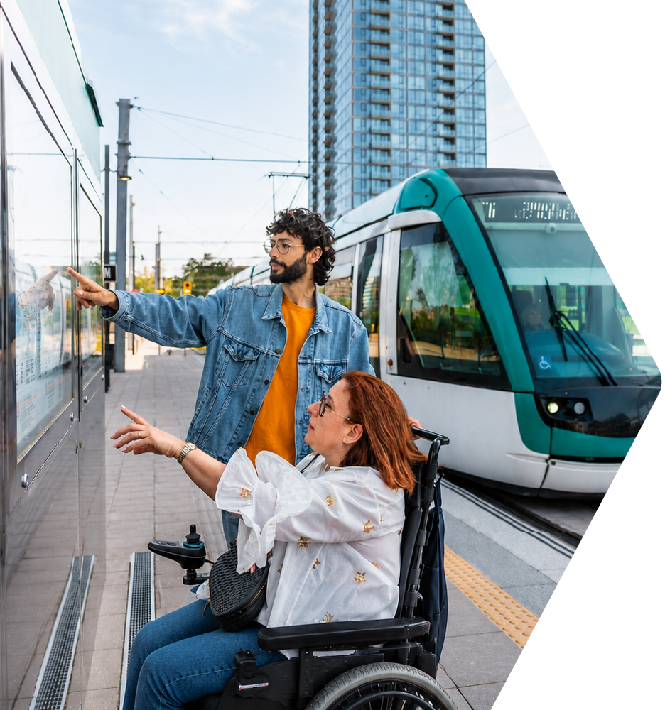 Travel trainer and trainee looking at a transit map