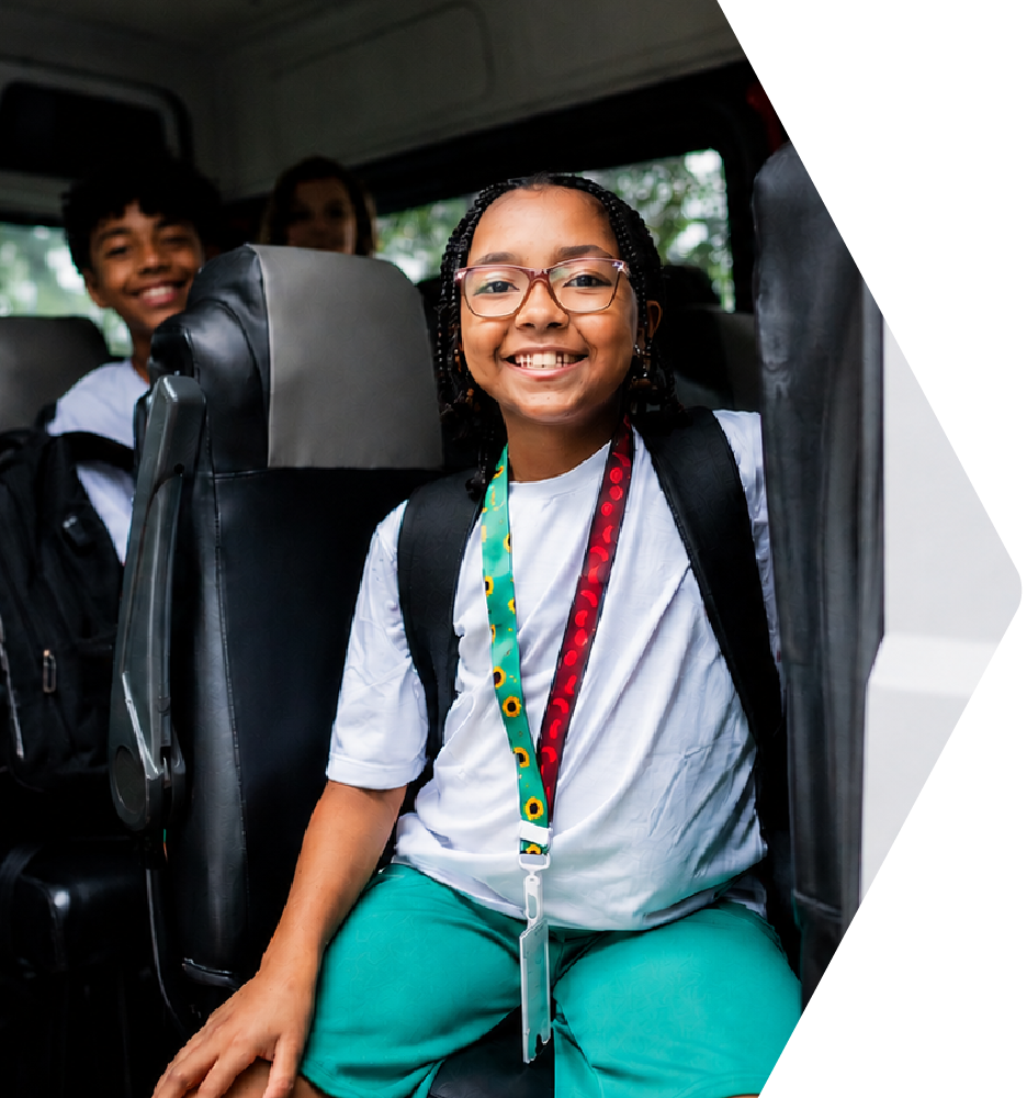 Smiling students in the back of a van